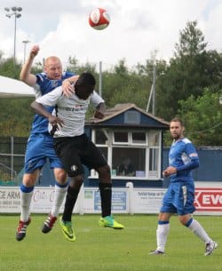 Richard Teesdale heads the ball clear. Pic: Dave Birt