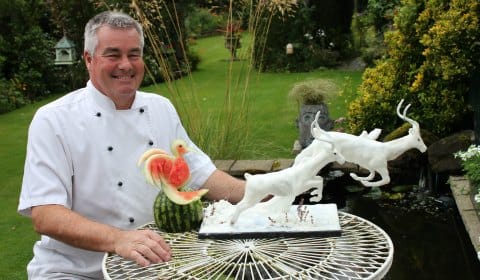 Simon Smith with two of his food sculpture creations