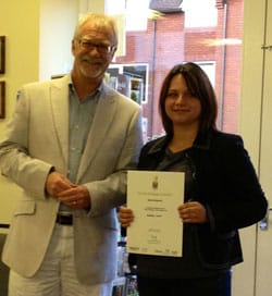 A student receiving her certificate