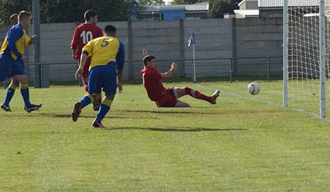 DSC01582 Jonathan Huckfield slides the ball home