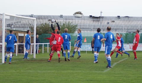 Craig Johnson claims a cross in the air