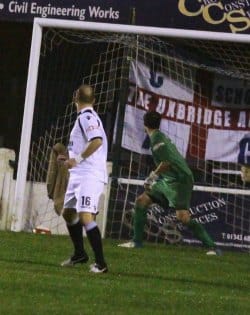 Mariusz Kisiel can only watch as the ball finds the net. Pic: Dave Birt