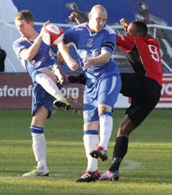 danny-ashton-and-rich-teesdale-challenge Danny Ashton and Richard Teesdale battle for the ball. Pic: Dave Birt