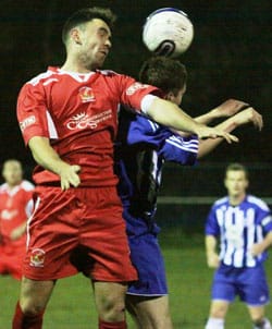 Richard Bryan heads the ball away. Pic: Dave Birt