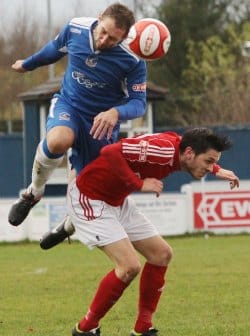 Chris Slater heads the ball clear. Pic: Dave Birt