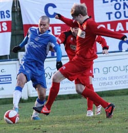 Gary Hay keeps the ball away from two defenders. Pic: Dave Birt