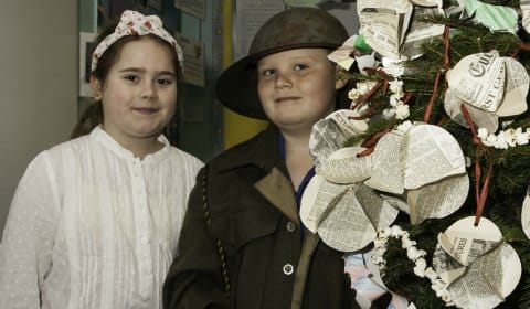 SONY DSC Kate Cotton as a land girl and Oliver Grigg as a solider in front of their Christmas tree