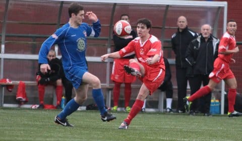Lee Parsons and Danny Smith battle for the ball. Pic: Dave Birt