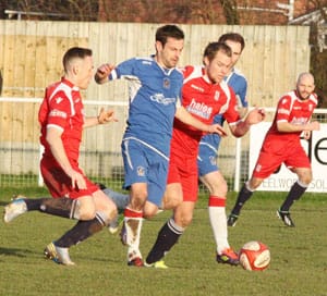 Dave Bate outpaces two defenders. Pic: Dave Birt