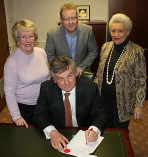 Val Richards, James Leavesley, Adrian Jackson and Margaret Stanhope signing the agreement