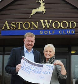 Steve Staunton hands over a cheque to Lyn Shiel from St Giles Hospice