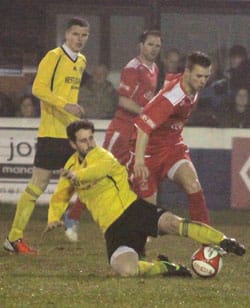 A tackle goes in on Joel Purkiss. Pic: Dave Birt