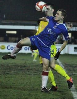 Paul Sullivan tries to hold off a defender. Pic: Dave Birt