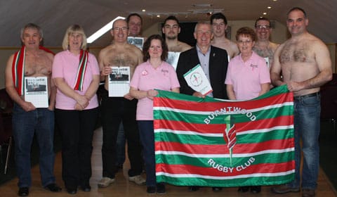 The cheques are handed over by some of Burntwood RUFC's calendar stars