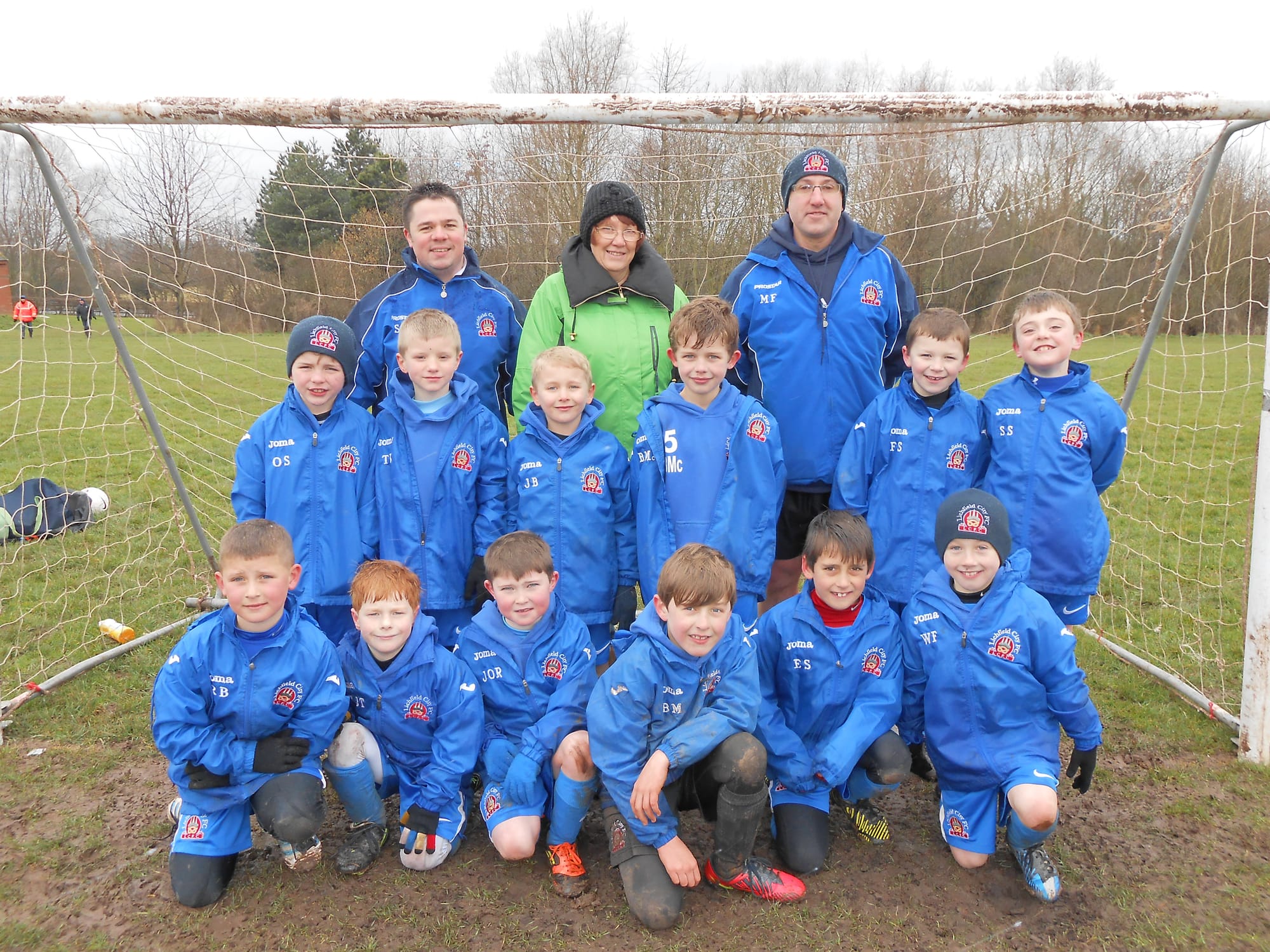 Lichfield City Spitfires under 8s football team with their sponsor Margaret McLellan from Splashers Swim School