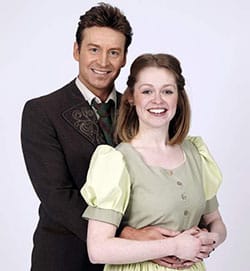 Sophie Randal as Maria and Jordan Adams as Captain Georg von Trapp