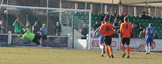 Simon Brown tucks home from the penalty spot. Pic: Dave Birt