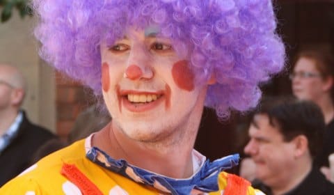 A clown is all smiles in the 2012 Lichfield Bower procession