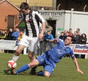 Danny Smith slides in to make a tackle. Pic: Dave Birt