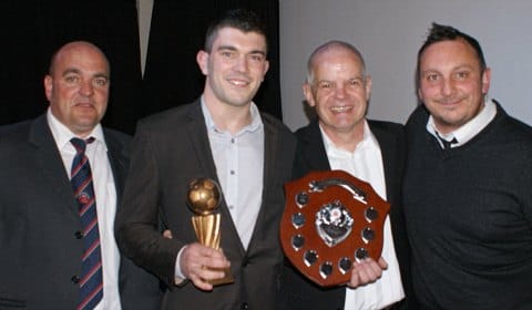 Liam Holt with his awards