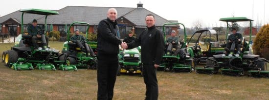 Simon Smith, left, with John Deere agent Kevin Pugh and the greens team in the new mowers
