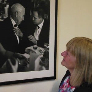 Shugborough staff member Jackie Moseley with Lord Lichfield's photograph of Charlie Chaplin and Marlon Brando