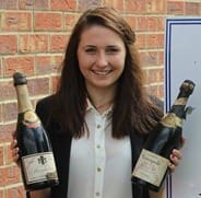 Elizabeth Bailey with the champagne bottles