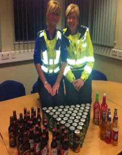 PCSO Jenna Gibbons and PCSO Lisa Anderson with the seized drinks