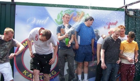 Drivers celebrate after the charity karting event