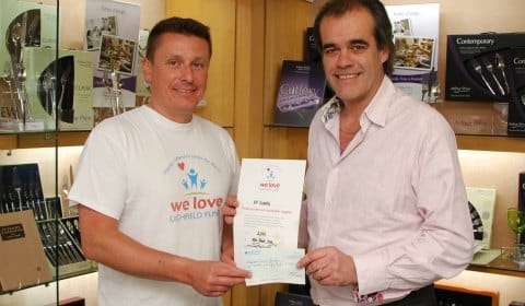 Paul Griffin hands over the donation to Simon Price