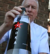 Mike Lawrence with one of the fake vodka bottles