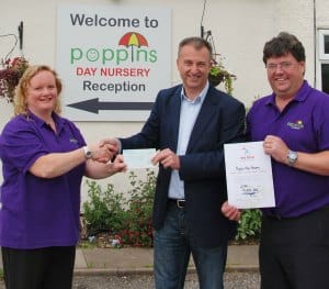 Julian Fisher accepts the cheque for We Love Lichfield from Poppins Day Nursery