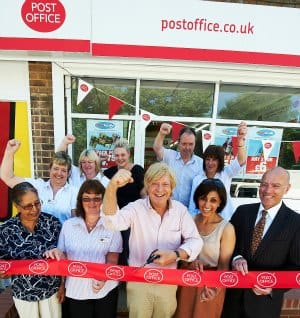Harjinder Sanjhera (owner), Kath Holyoak (shop manager), Michael Fabricant, Ravinder Sanghera (owner), and Martin Lahert (senior manager, Post Office).