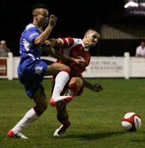 A heavy challenge goes in on Chasetown's Theo Robinson. Pic: Dave Birt