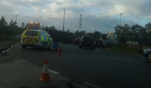 Police at the scene of the overturned lorry