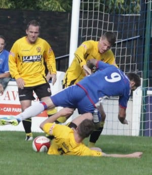 Nick Wellecomme's path to goal is blocked by a Belper defender. Pic: Dave Birt
