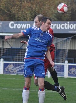 Craig Bannister battles for the ball in the air. Pic: Pamela Mullins