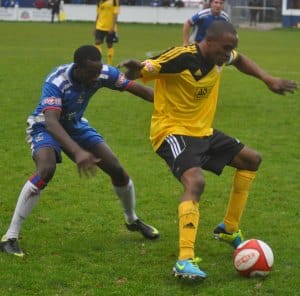 Ramone Stephens closes down his man. Pic: Pamela Mullins