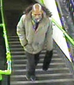 A CCTV image of the man police want to speak to about the missing mountain bike