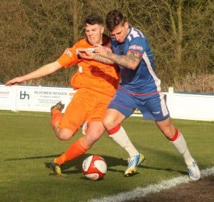 Danny Bragoli tries to get away from his man. Pic: Dave Birt