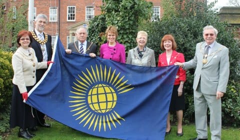 Civic leaders with the Commonwealth flag in Lichfield