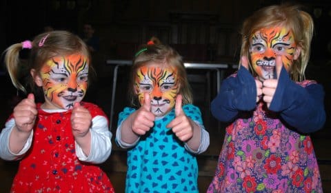 Youngsters show off their face painting at the Big Green Fair
