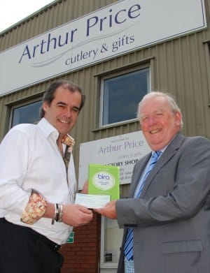 Simon Price being presented with the Charitable Champions Award by David Smyth