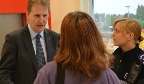 Matthew Ellis talking to a shopper with PCSO Nia Nokes