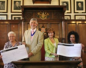 Kathy Peat from Lichfield Arthritis Care and Marie Bright from Lichfield Young Carers receive their cheques from Cllr David Leytham and his wife Jan