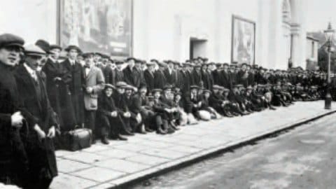 Men queuing to sign up at a national recruitment centre during World War One. Pic: National Army Museum