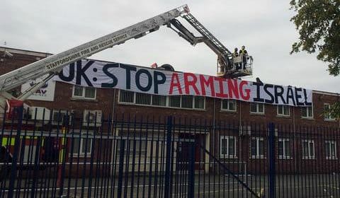 Police in a cherrypicker trying to talk to the protesters. Pic: London Palestine Action