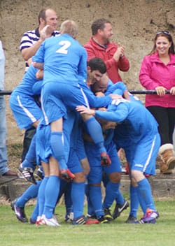 Lichfield's players celebrate a Mark Rose goal. Pic: Mick Tyler