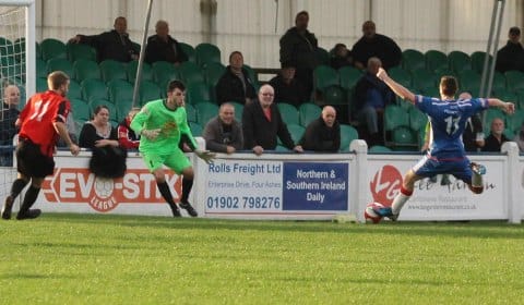 Richard Davies connects with the ball to steer it home. Pic: Dave Birt