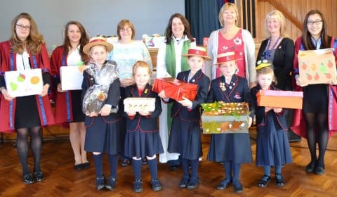 The Revd Vivienne Flanaghan with staff and pupils from Abbots Bromley School.